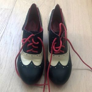 EUC lace up, black and cream heels. So cute with a suit or a skirt.